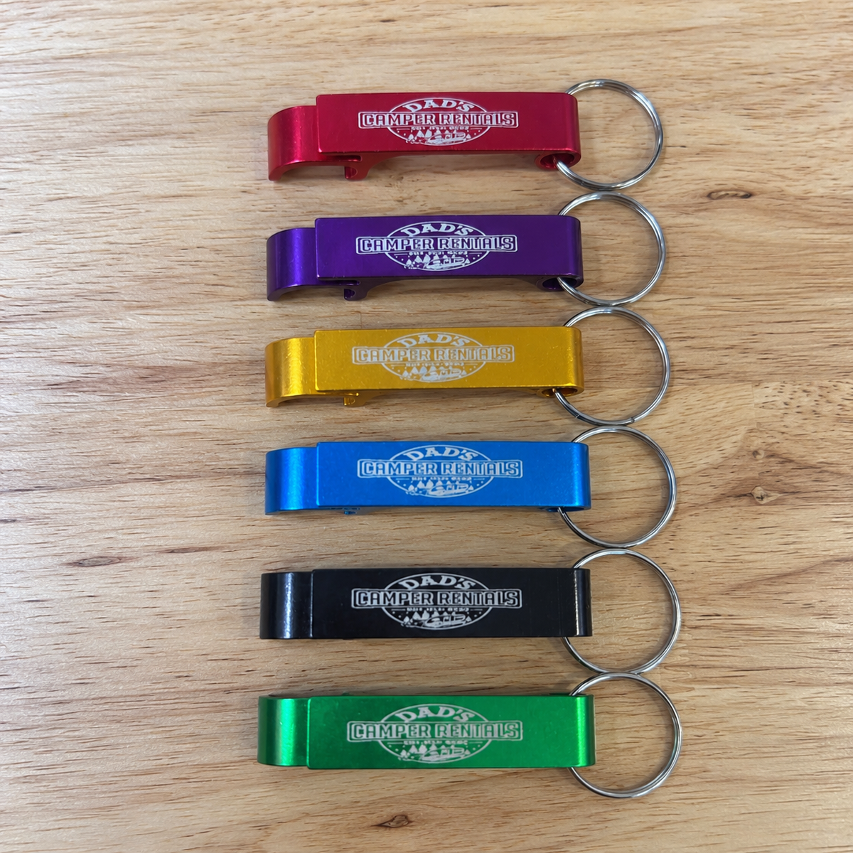 Custom laser-engraved metal bottle openers with keyrings in assorted colors