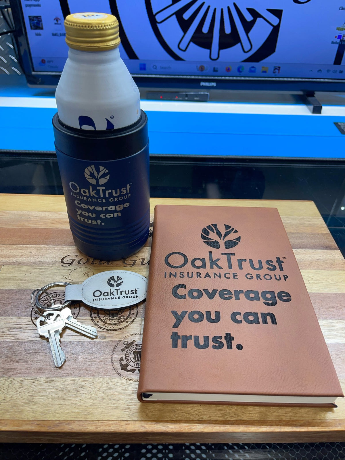 Engraved rawhide leatherette journal with a matching insulated bottle and keychain