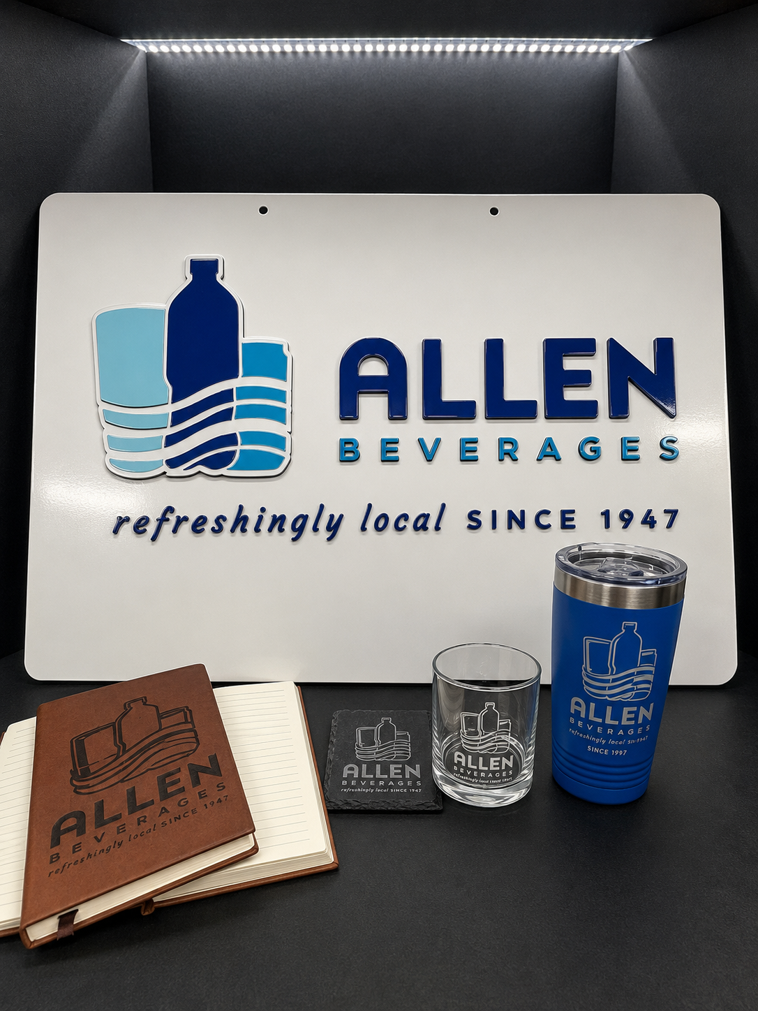 Allen Beverages business branding project by Gold Gulf Coast Design, including a custom sign, engraved journal, slate coaster, rocks glass, and tumbler